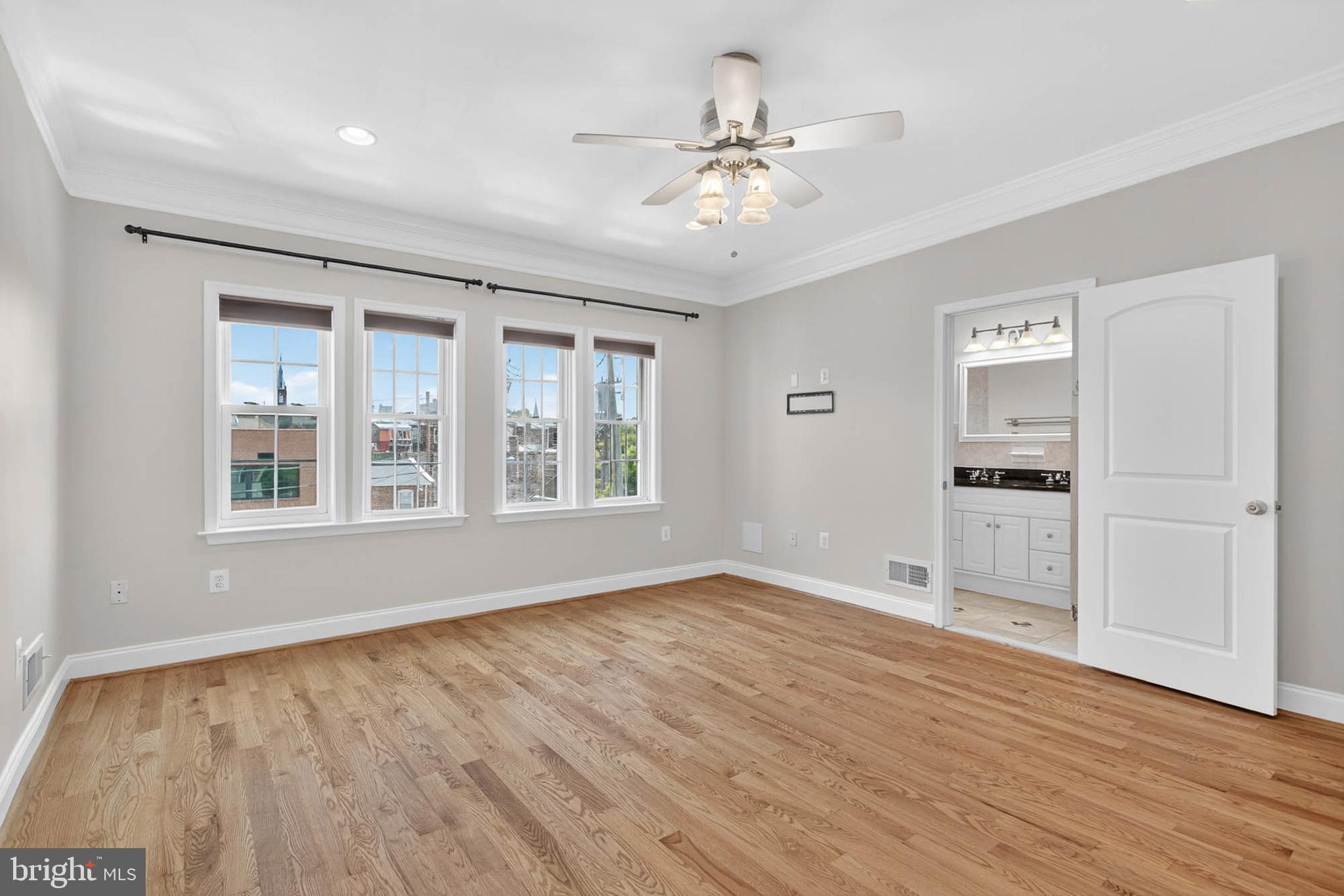 1125 Race Street Baltimore, MD 21230 - Photo 29 of 43 a view of an empty room with a window and wooden floor