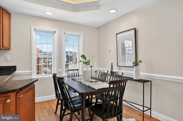 a view of a dining room with furniture and window