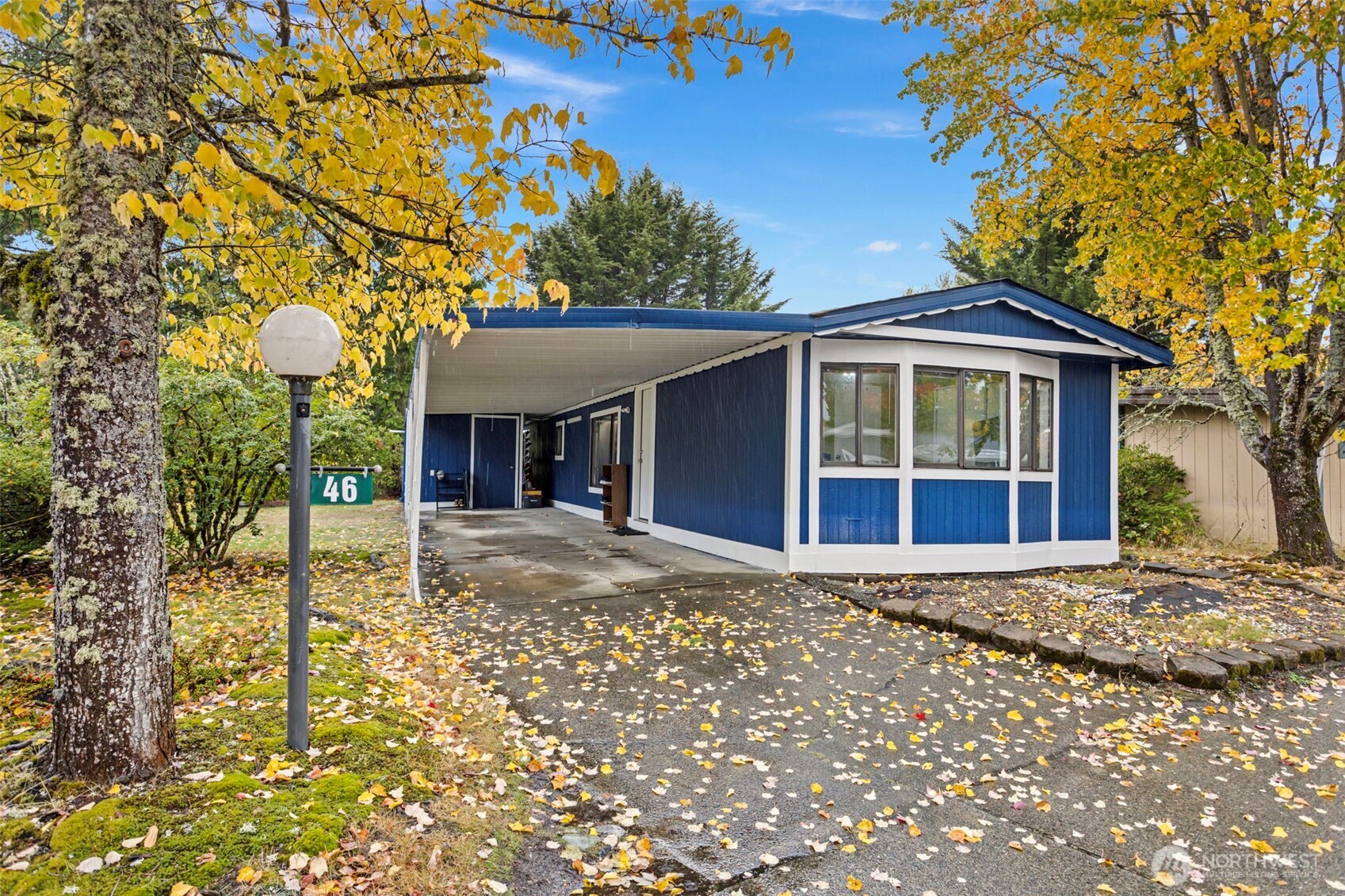 375 Union Avenue Southeast, Unit 46 Renton, WA 98059 - Photo 1 of 17 a front view of a house with a porch