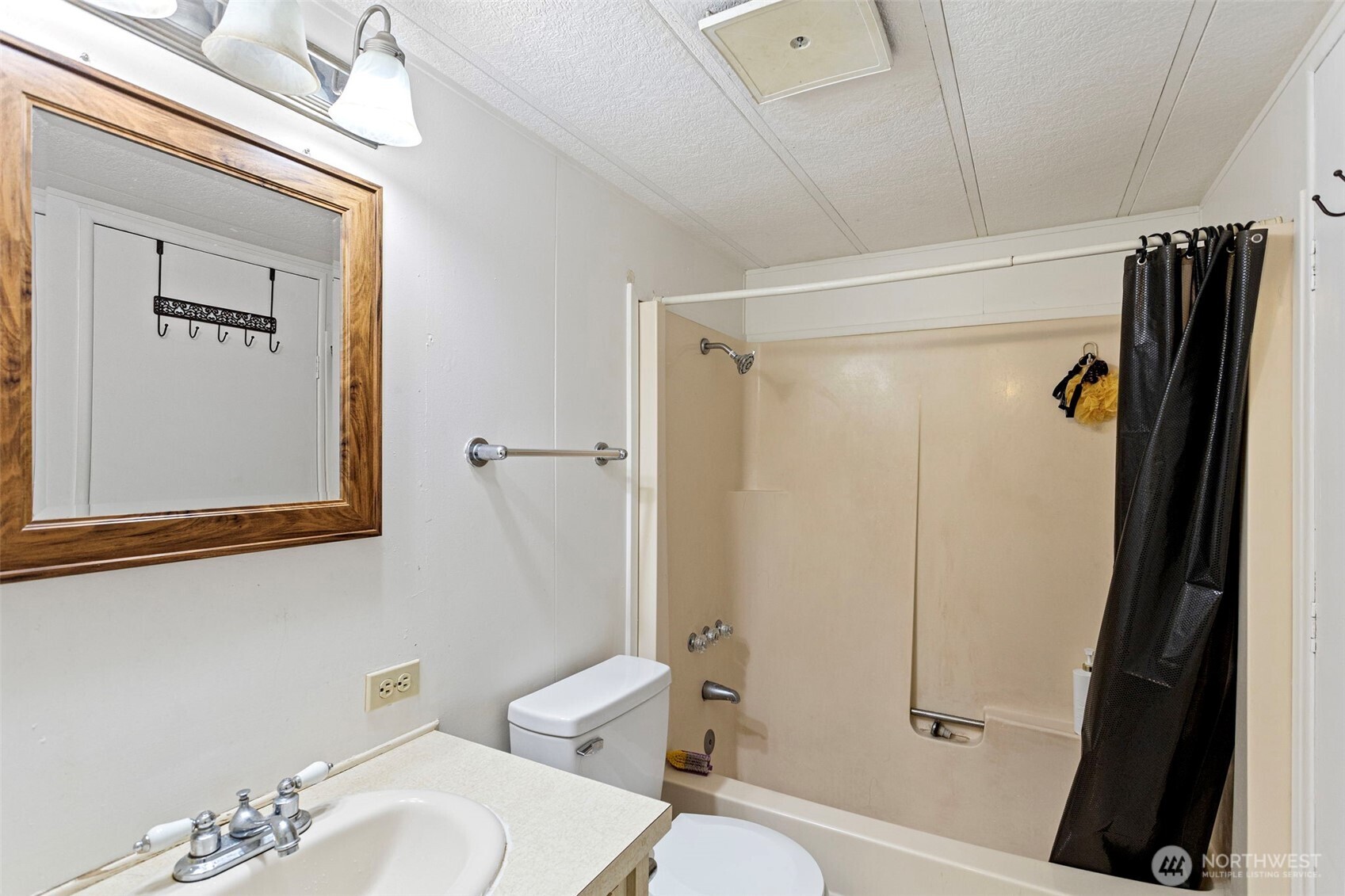 375 Union Avenue Southeast, Unit 46 Renton, WA 98059 - Photo 15 of 17 a bathroom with a sink toilet and shower
