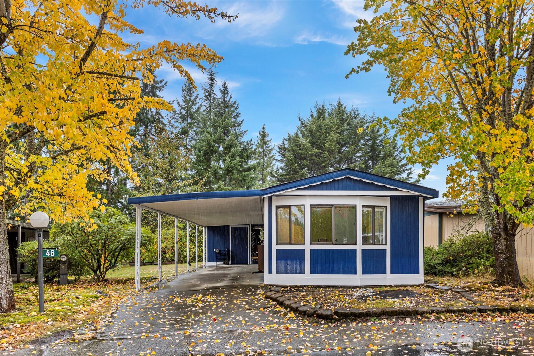 375 Union Avenue Southeast, Unit 46 Renton, WA 98059 - Photo 2 of 17 a front view of a house with a garden