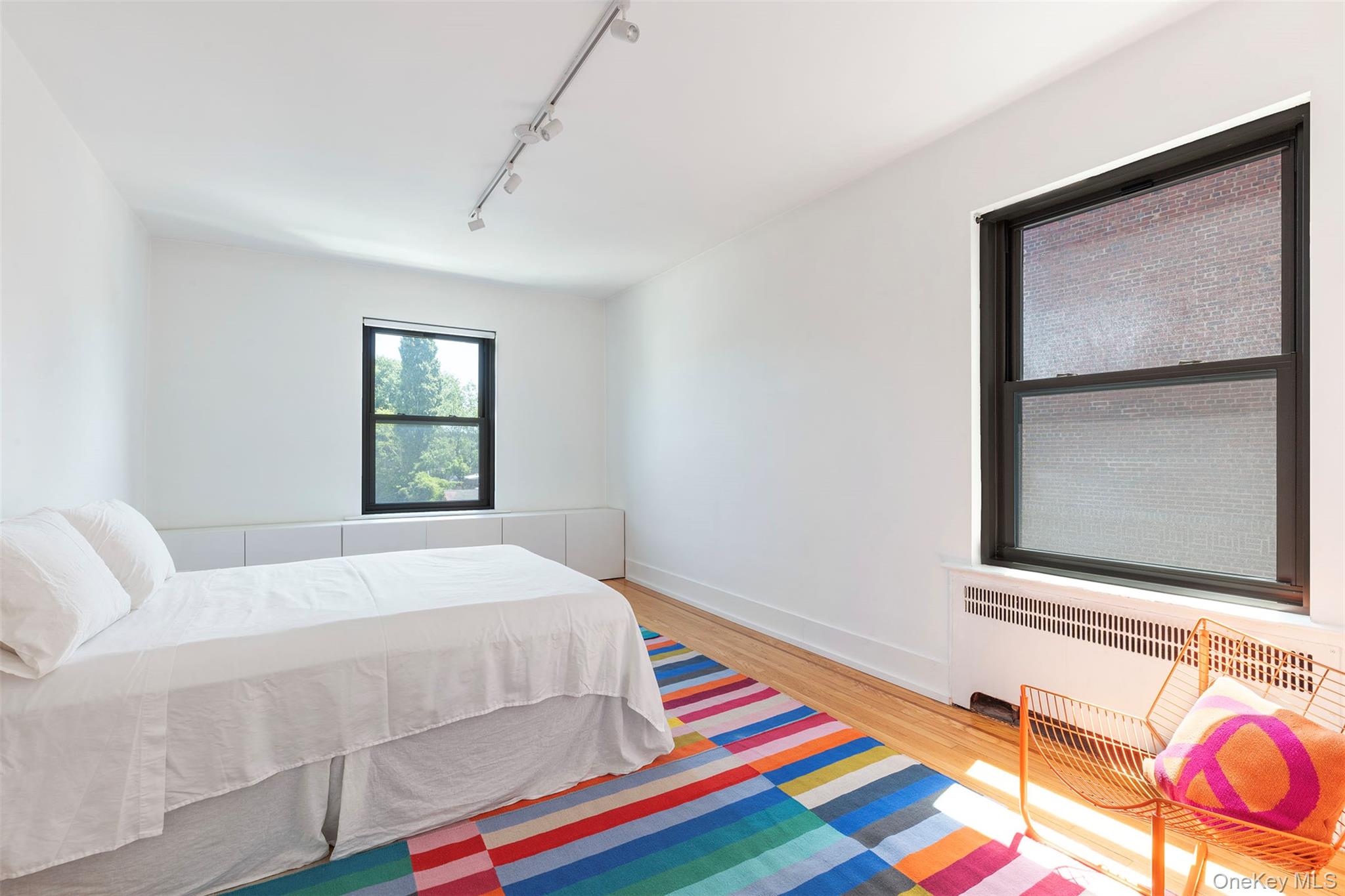 76-66 Austin Street, Unit 3L Queens, NY 11375 - Photo 18 of 28 a bedroom with a bed and a window