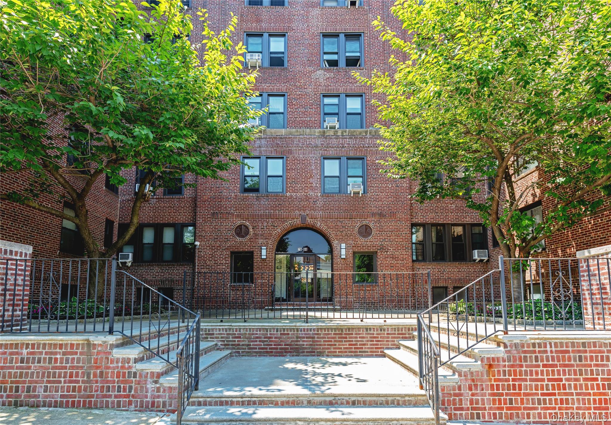 76-66 Austin Street, Unit 3L Queens, NY 11375 - Photo 24 of 28 a front view of a house with garden