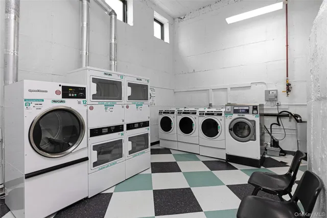 a view of a dining room with furniture a chandelier and wooden floor