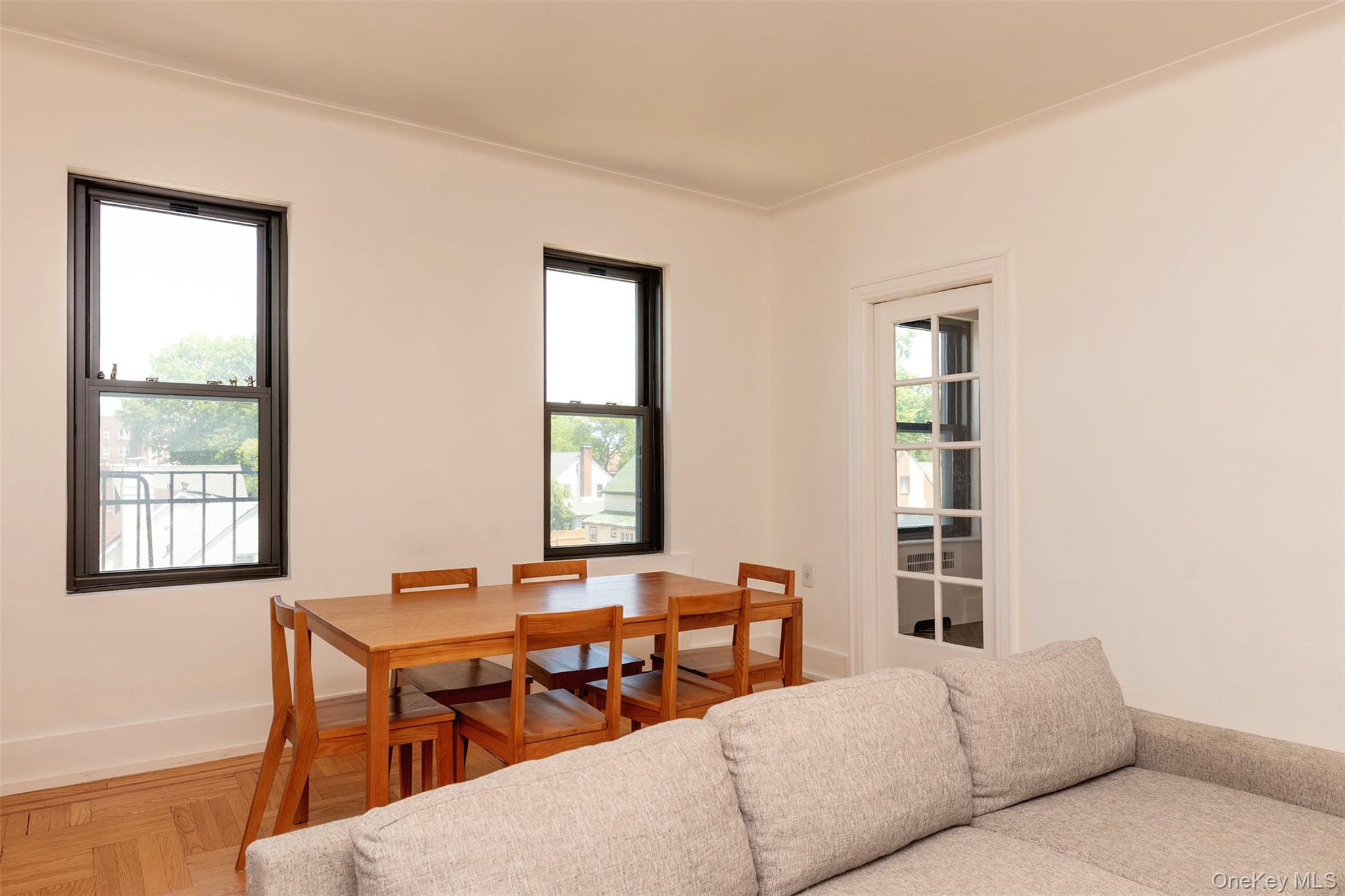 76-66 Austin Street, Unit 3L Queens, NY 11375 - Photo 3 of 28 a living room with furniture a window and a table