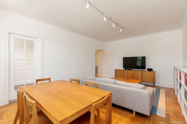 a bedroom with a bed and a television