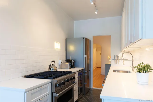 a kitchen with a stove and a sink