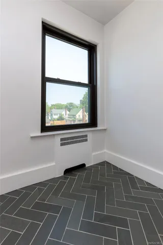view of an empty room with a window