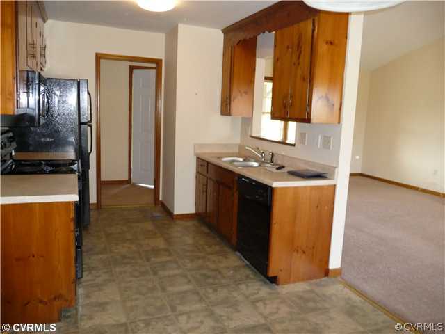 7701 Drexelbrook Road Chesterfield, VA 23832 - Photo 4 of 12 a kitchen with stainless steel appliances granite countertop a stove a sink and a refrigerator