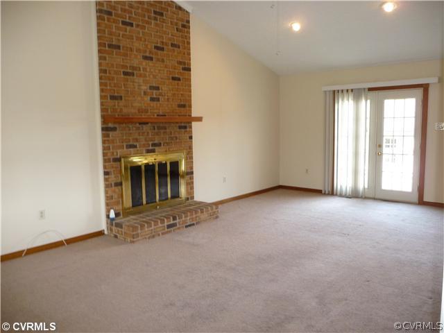 7701 Drexelbrook Road Chesterfield, VA 23832 - Photo 5 of 12 an empty room with a fireplace