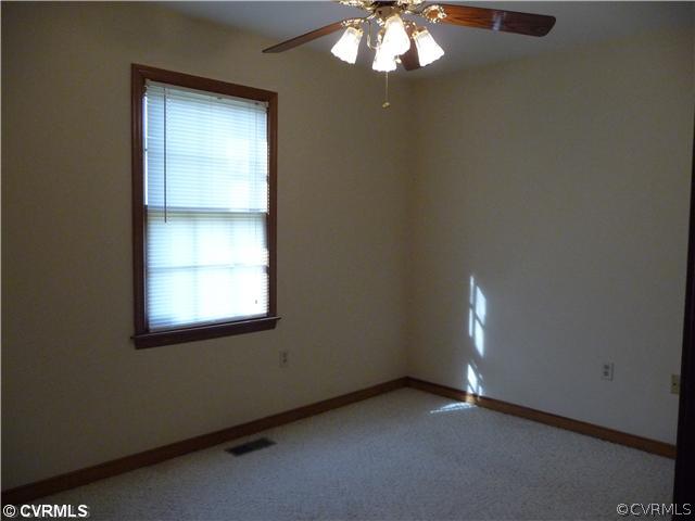 7701 Drexelbrook Road Chesterfield, VA 23832 - Photo 6 of 12 an empty room with a empty space and window