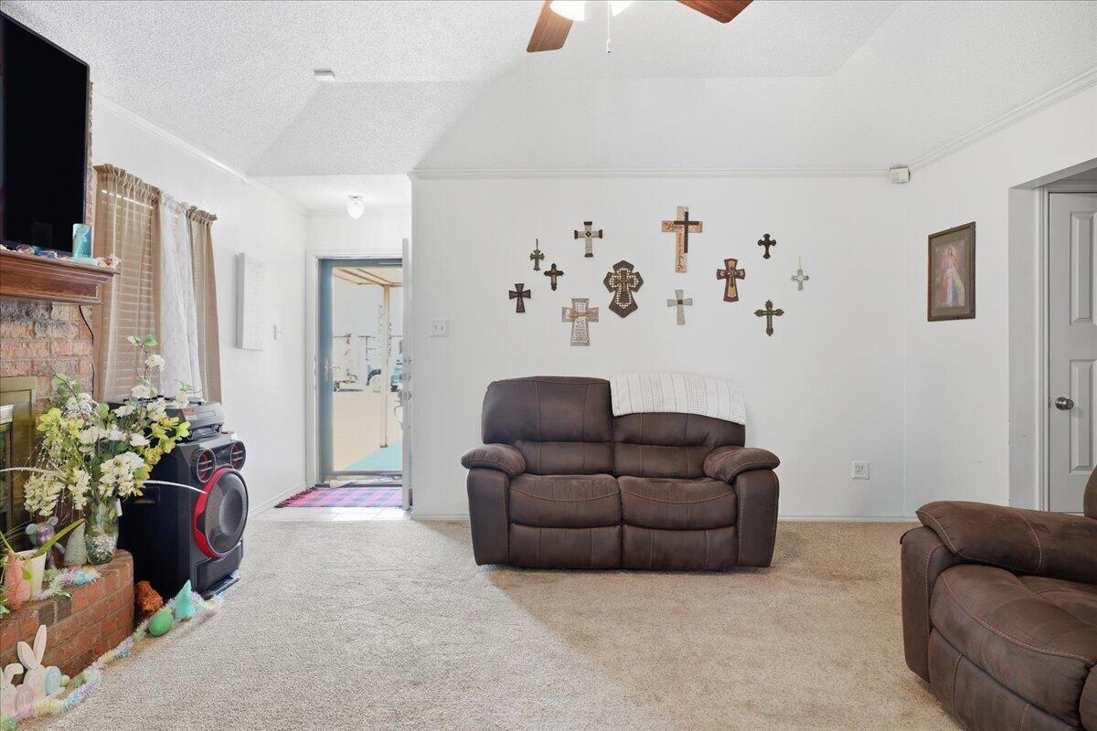2101 76th Street Lubbock, TX 79423 - Photo 4 of 20 a living room with furniture and flowers