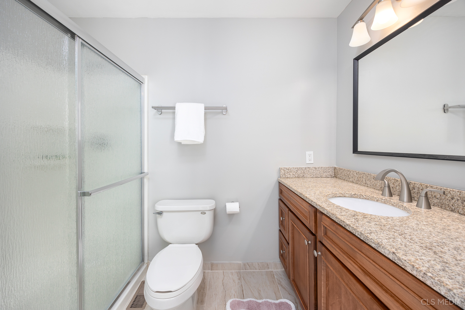 658 Cutter Lane Elk Grove Village, IL 60007 - Photo 15 of 33 a bathroom with a granite countertop toilet sink and mirror