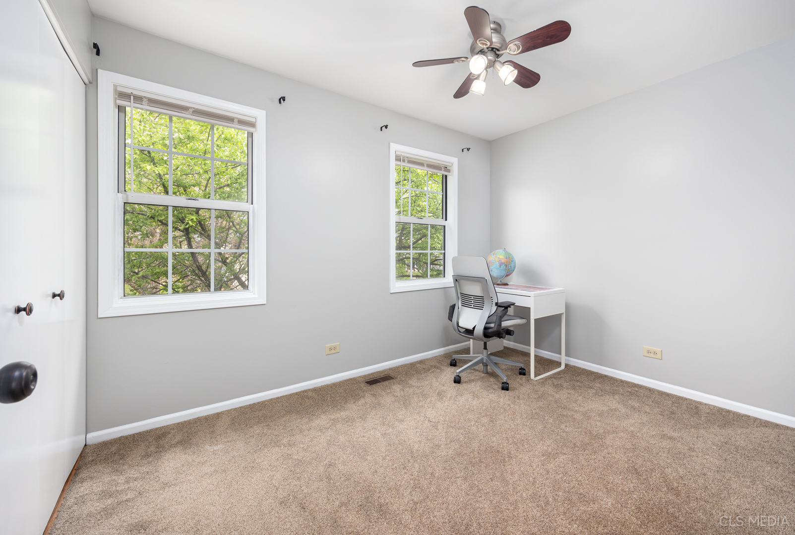658 Cutter Lane Elk Grove Village, IL 60007 - Photo 16 of 33 a room with a window and a ceiling fan