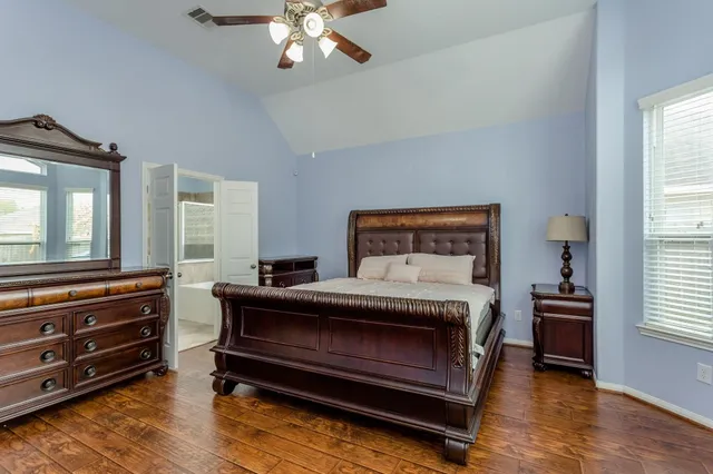 a bedroom with furniture and a window
