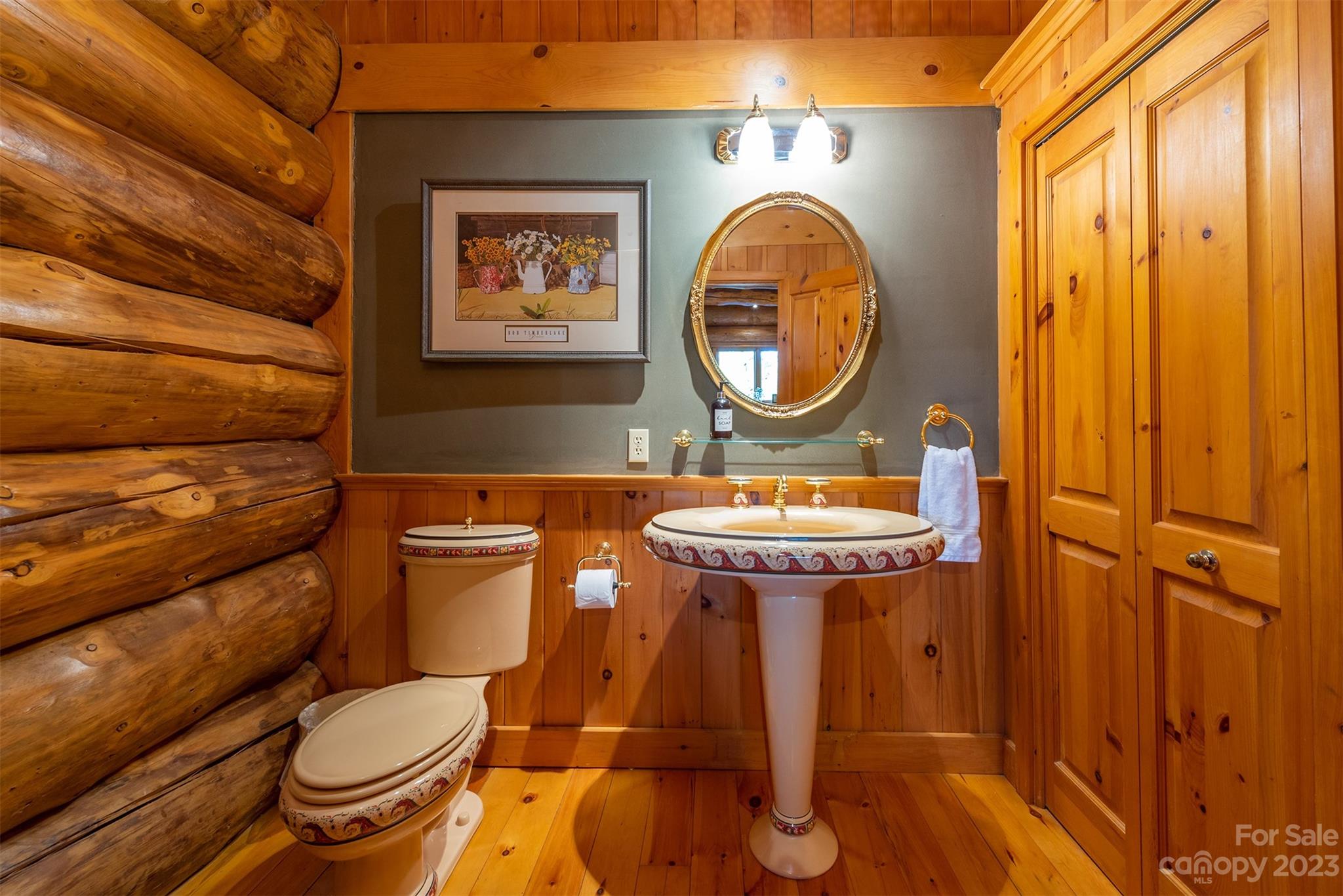 685 Talbot Drive Canton, NC 28716 - Photo 12 of 48 a bathroom with a toilet a sink and a mirror