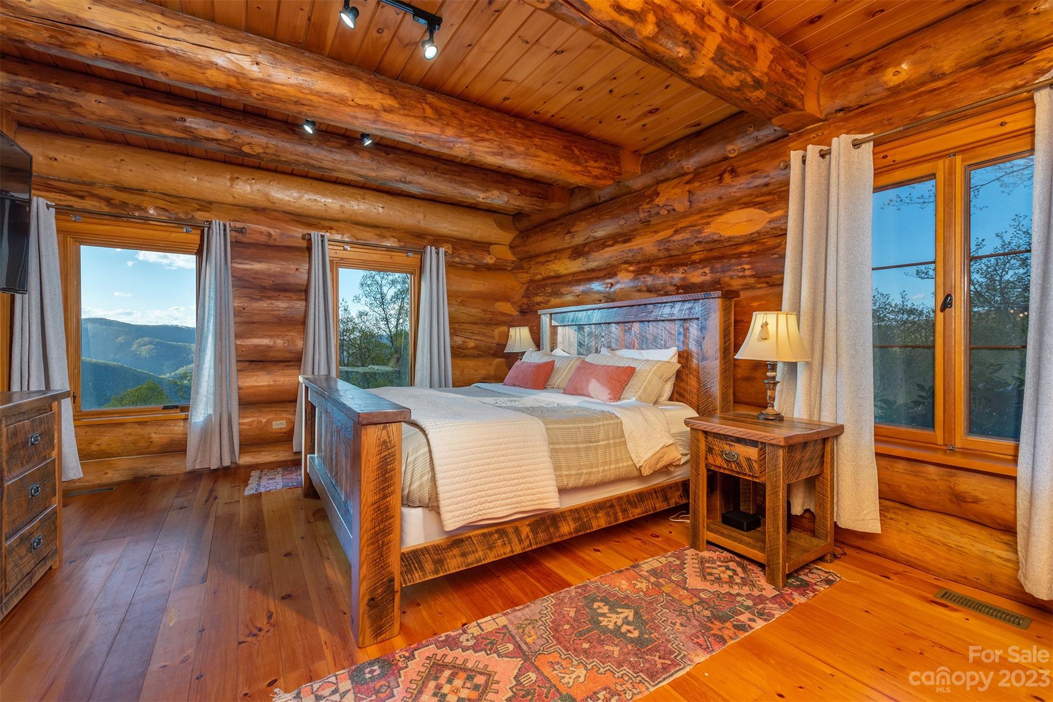 685 Talbot Drive Canton, NC 28716 - Photo 13 of 48 a bed sitting in a bedroom next to a window