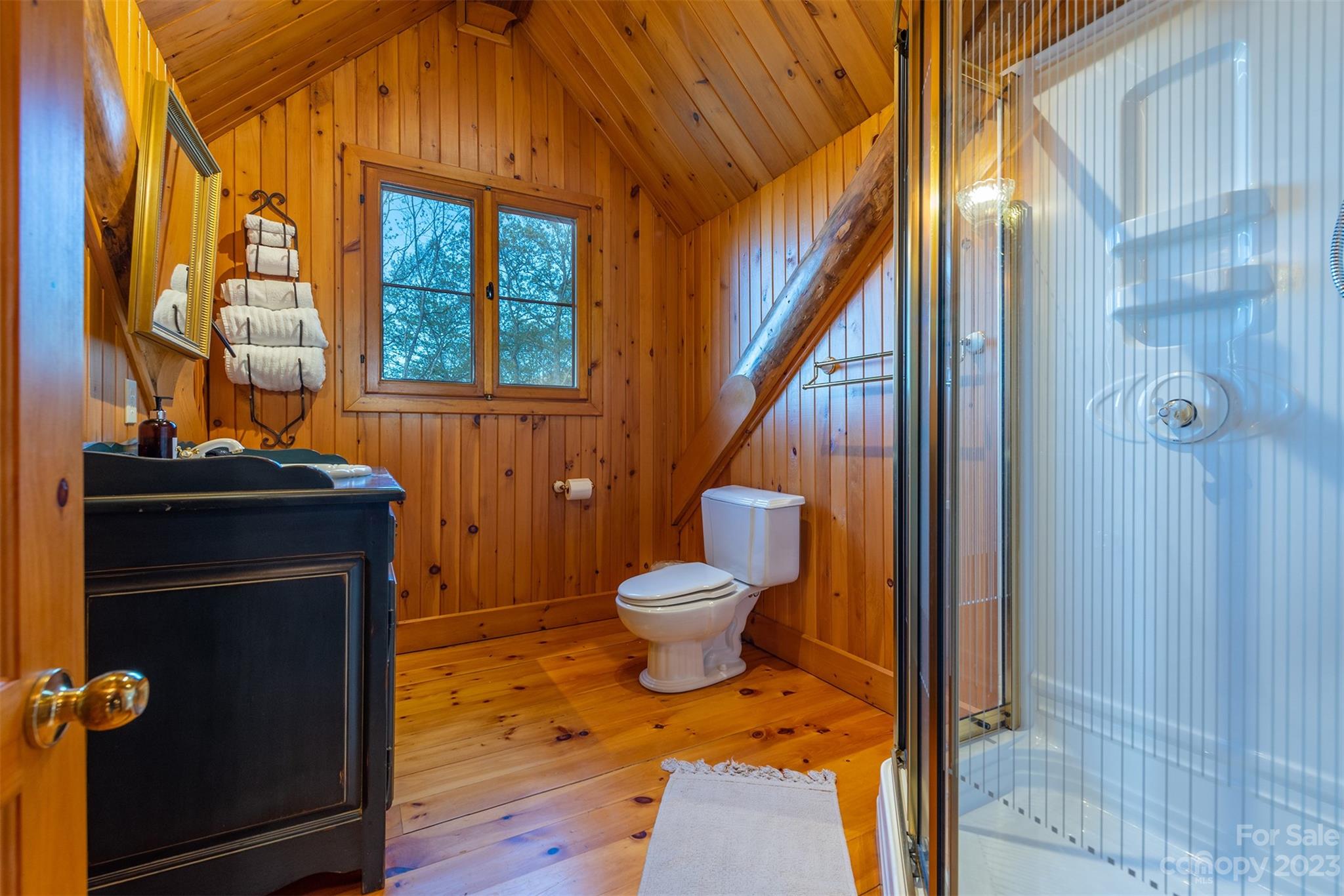 685 Talbot Drive Canton, NC 28716 - Photo 22 of 48 a bathroom with a toilet and a shower curtain
