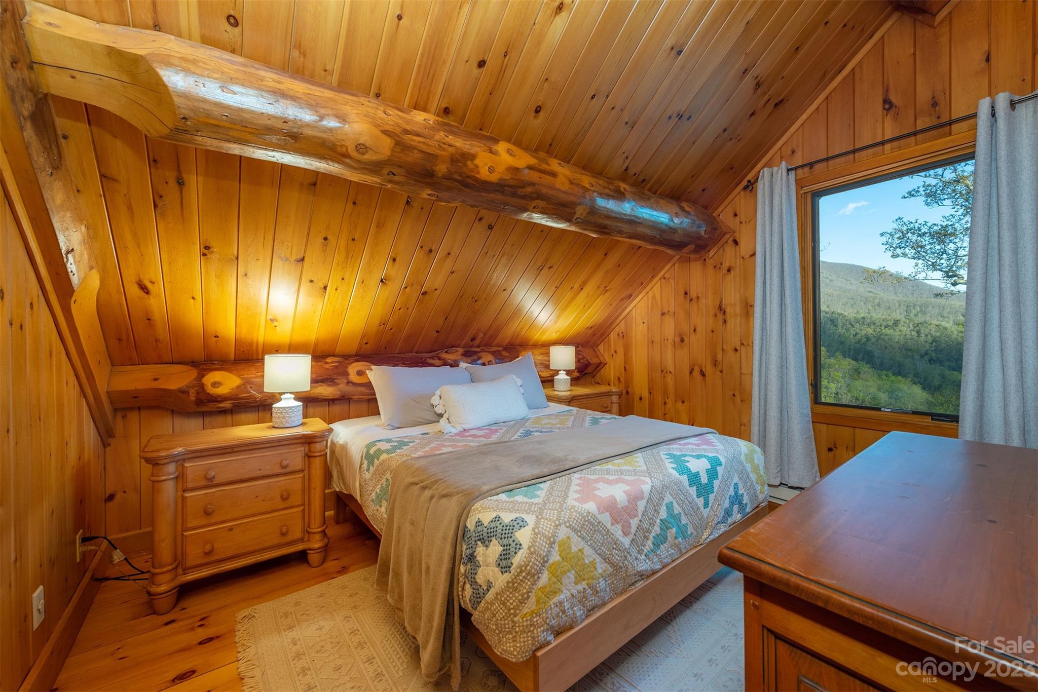 685 Talbot Drive Canton, NC 28716 - Photo 23 of 48 a bedroom with a bed and large window