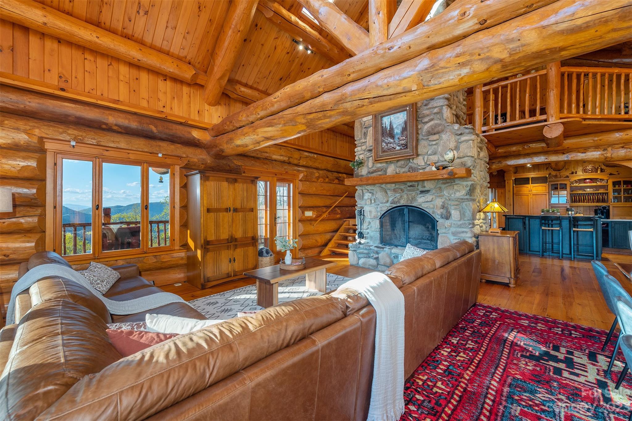 685 Talbot Drive Canton, NC 28716 - Photo 6 of 48 a living room with furniture a fireplace and a large window