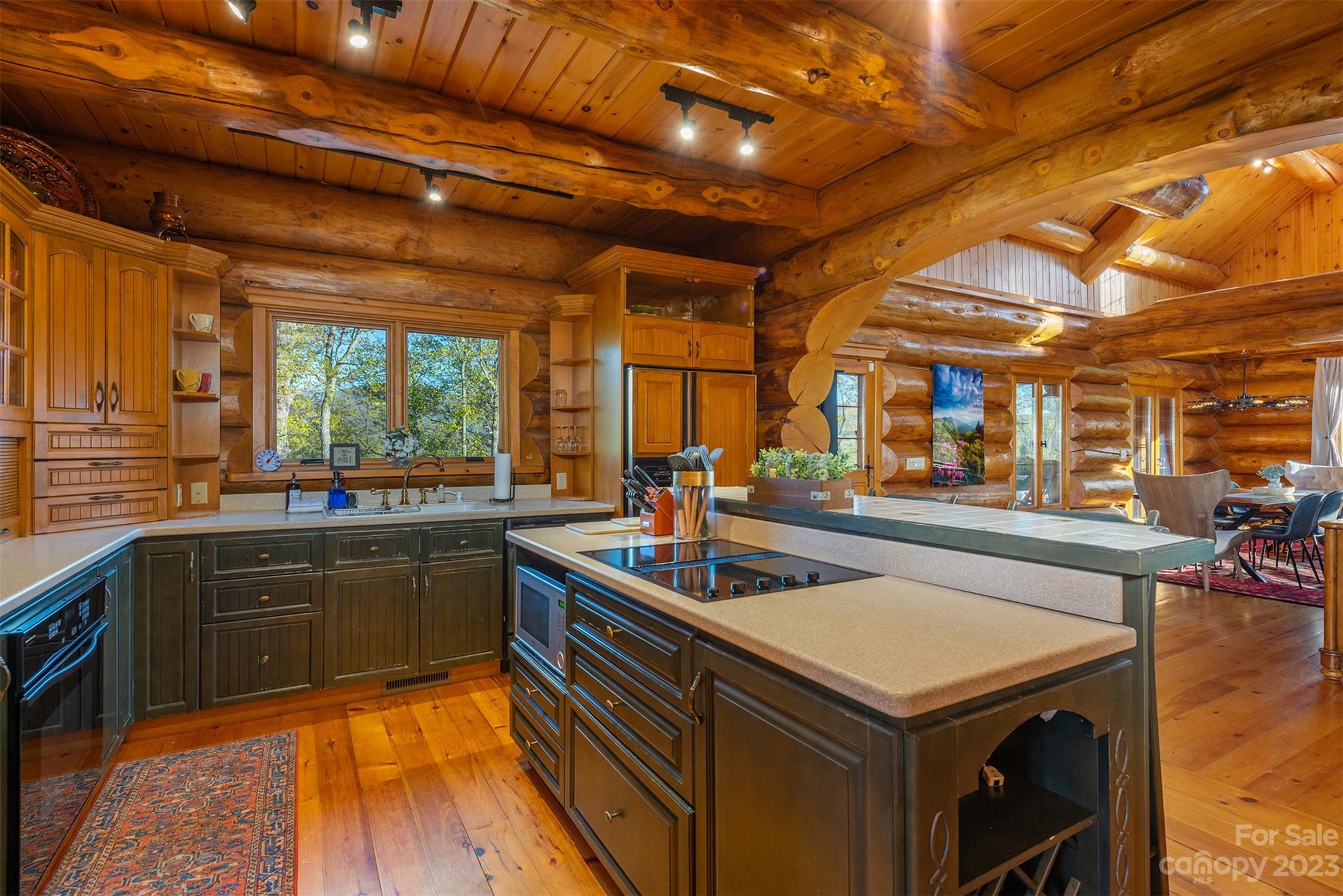 685 Talbot Drive Canton, NC 28716 - Photo 10 of 48 a kitchen with a sink and wooden cabinets