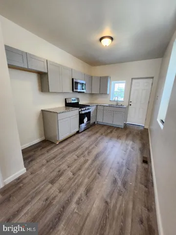 a view of a livingroom with wooden floor