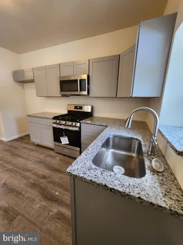 a bathroom with a sink and mirror