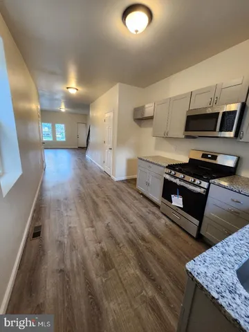 a white toilet sitting next to a shower