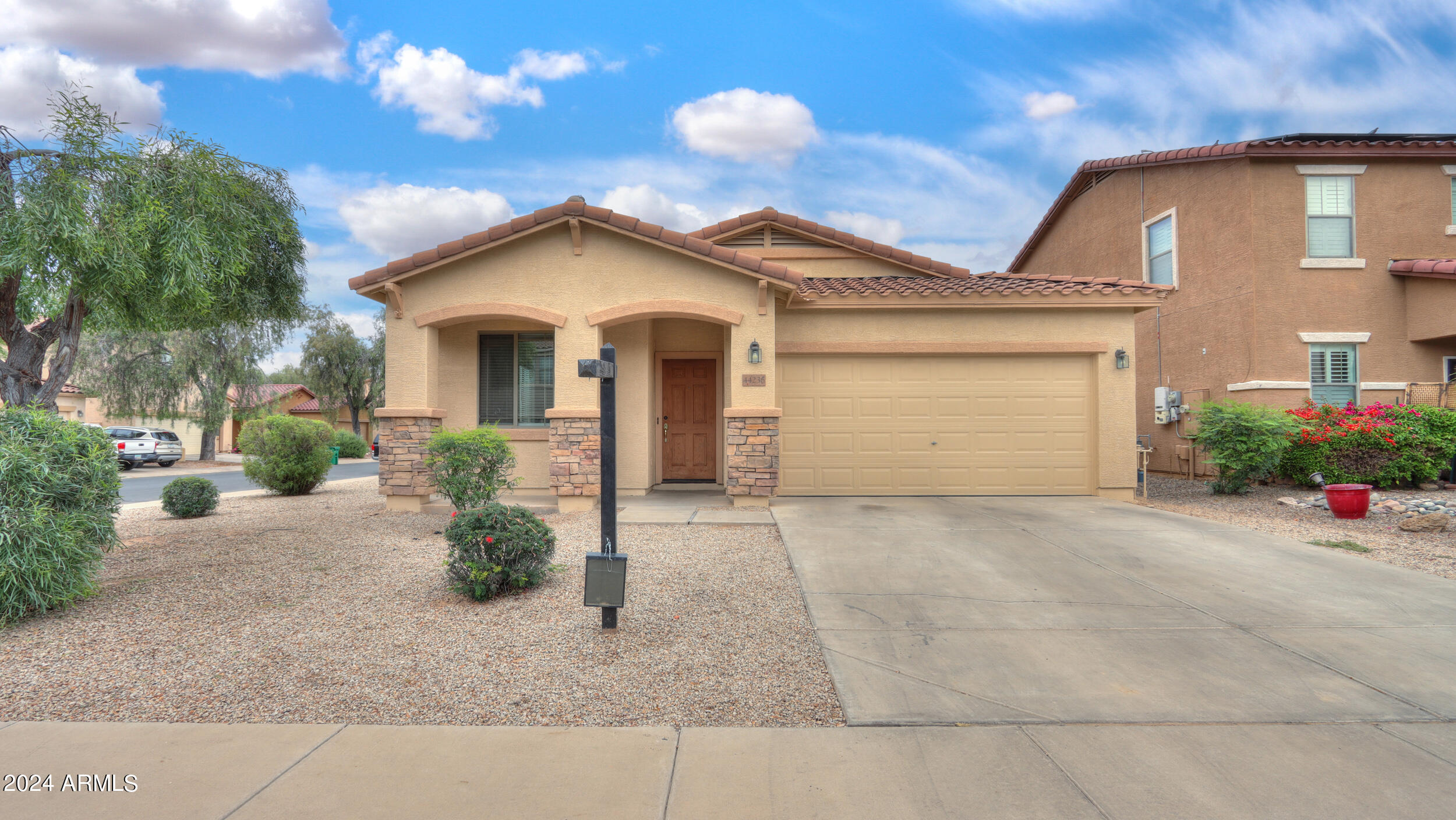 44236 Roth Road Maricopa, AZ 85138 - Photo 1 of 45 a front view of a house with garden