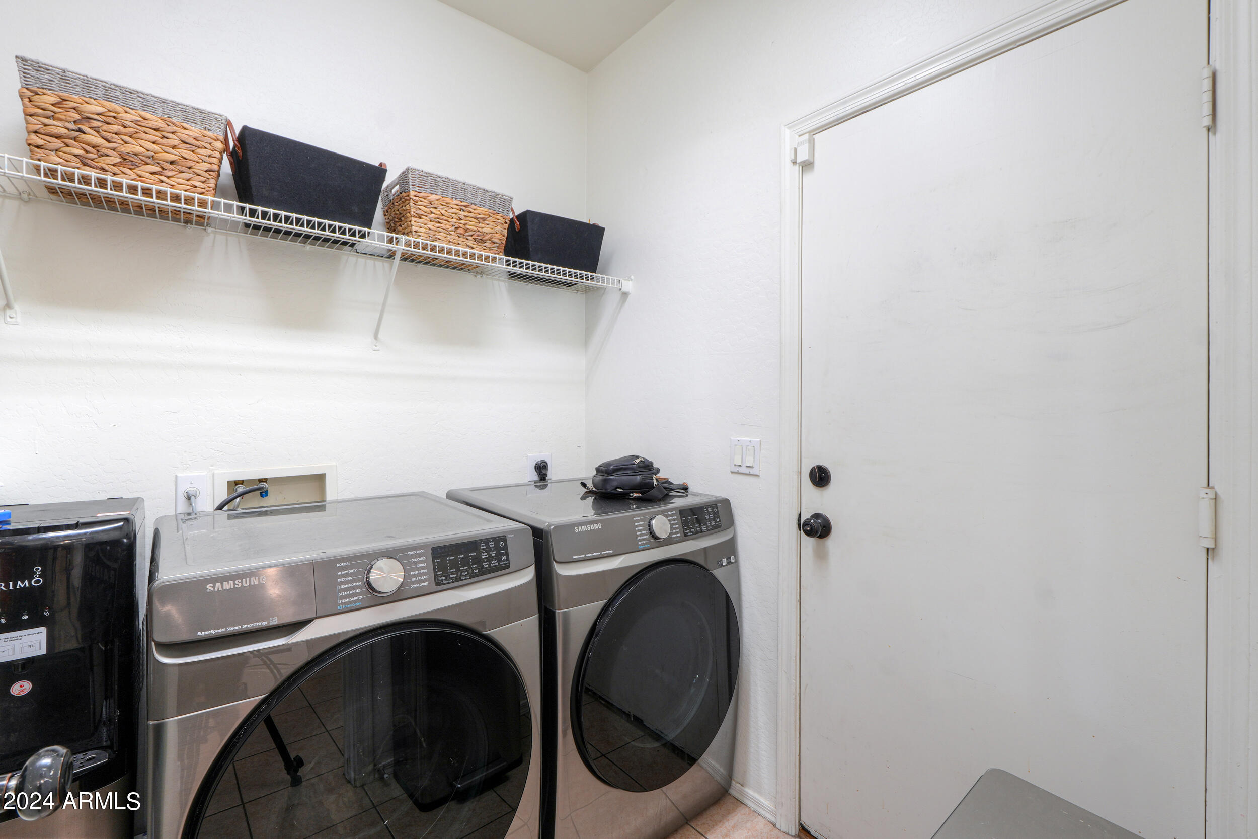 44236 Roth Road Maricopa, AZ 85138 - Photo 11 of 45 a utility room with dryer and washer