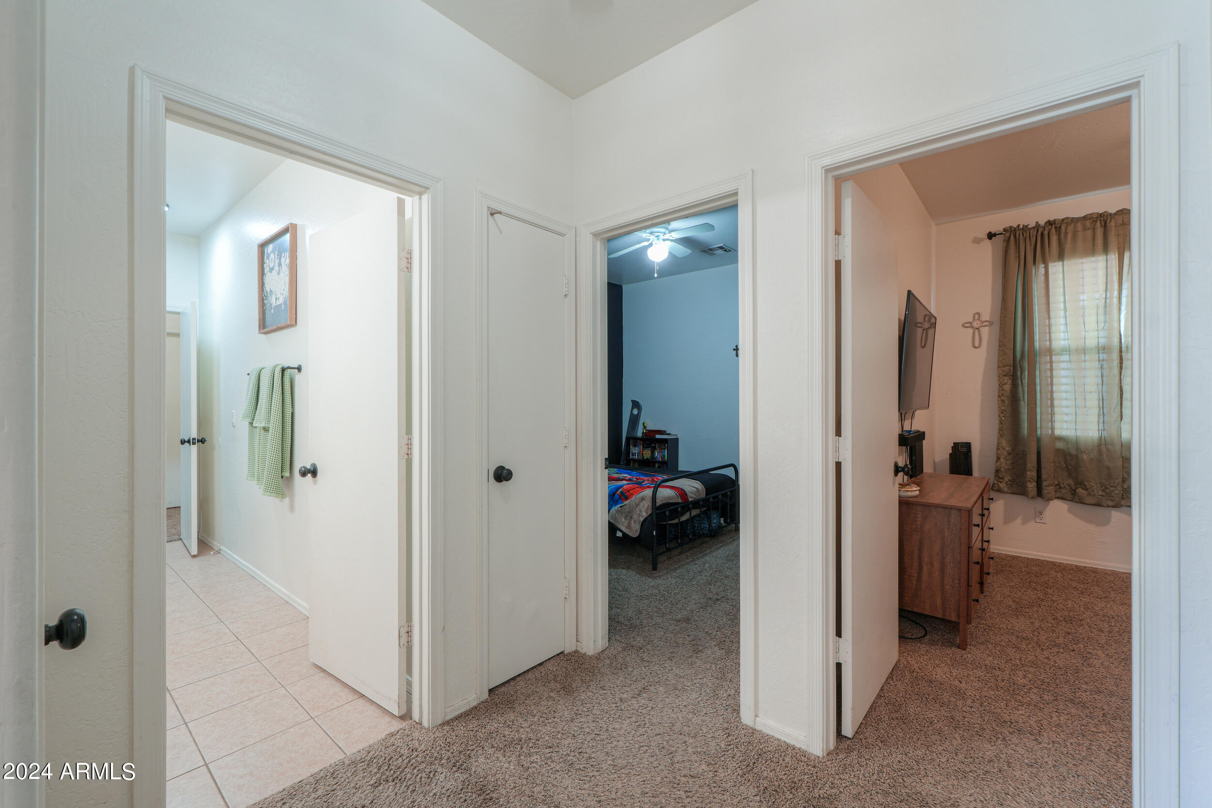 44236 Roth Road Maricopa, AZ 85138 - Photo 13 of 45 a view of a hallway with closet and a living room