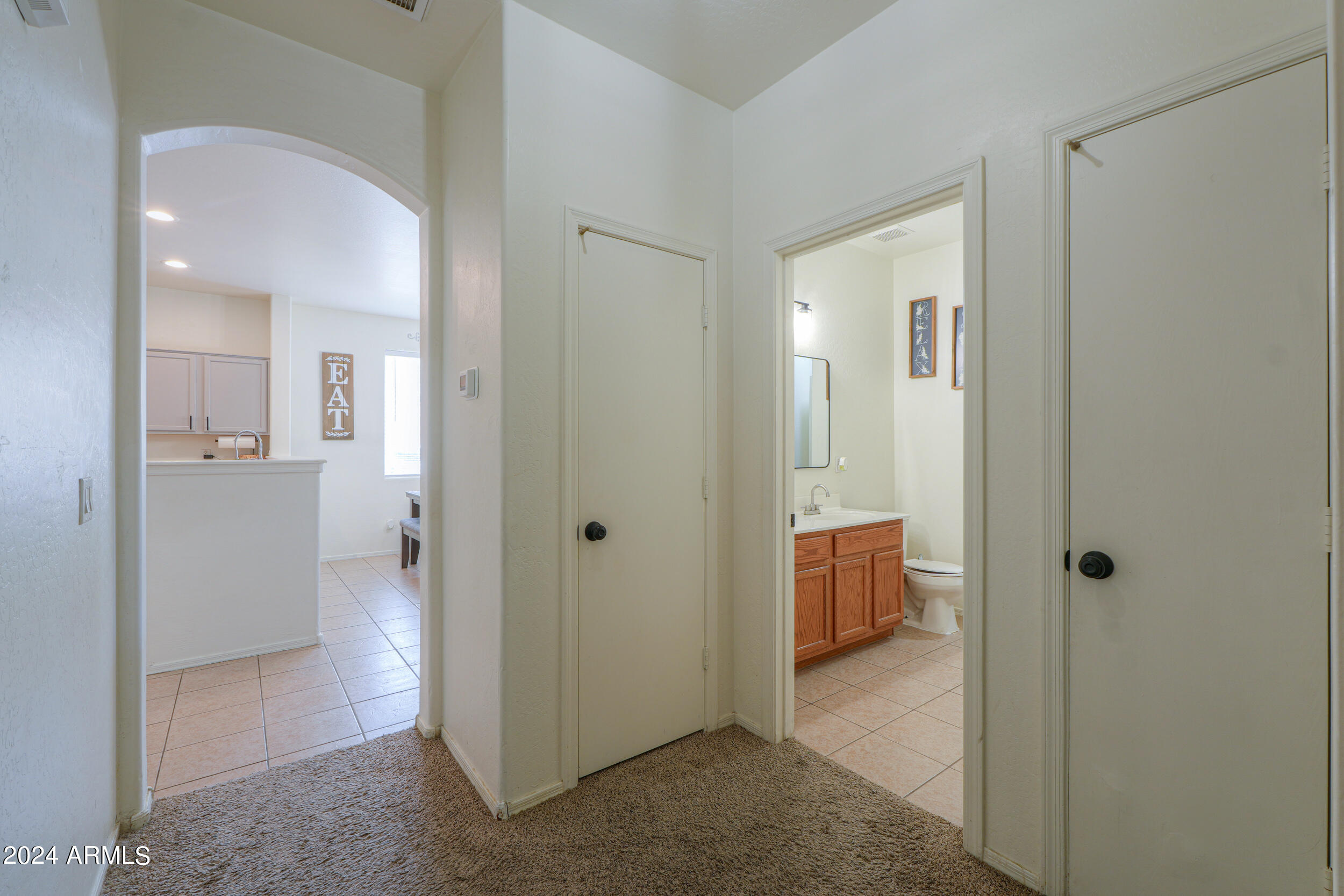 44236 Roth Road Maricopa, AZ 85138 - Photo 18 of 45 a view of a hallway with bathroom and a bathroom