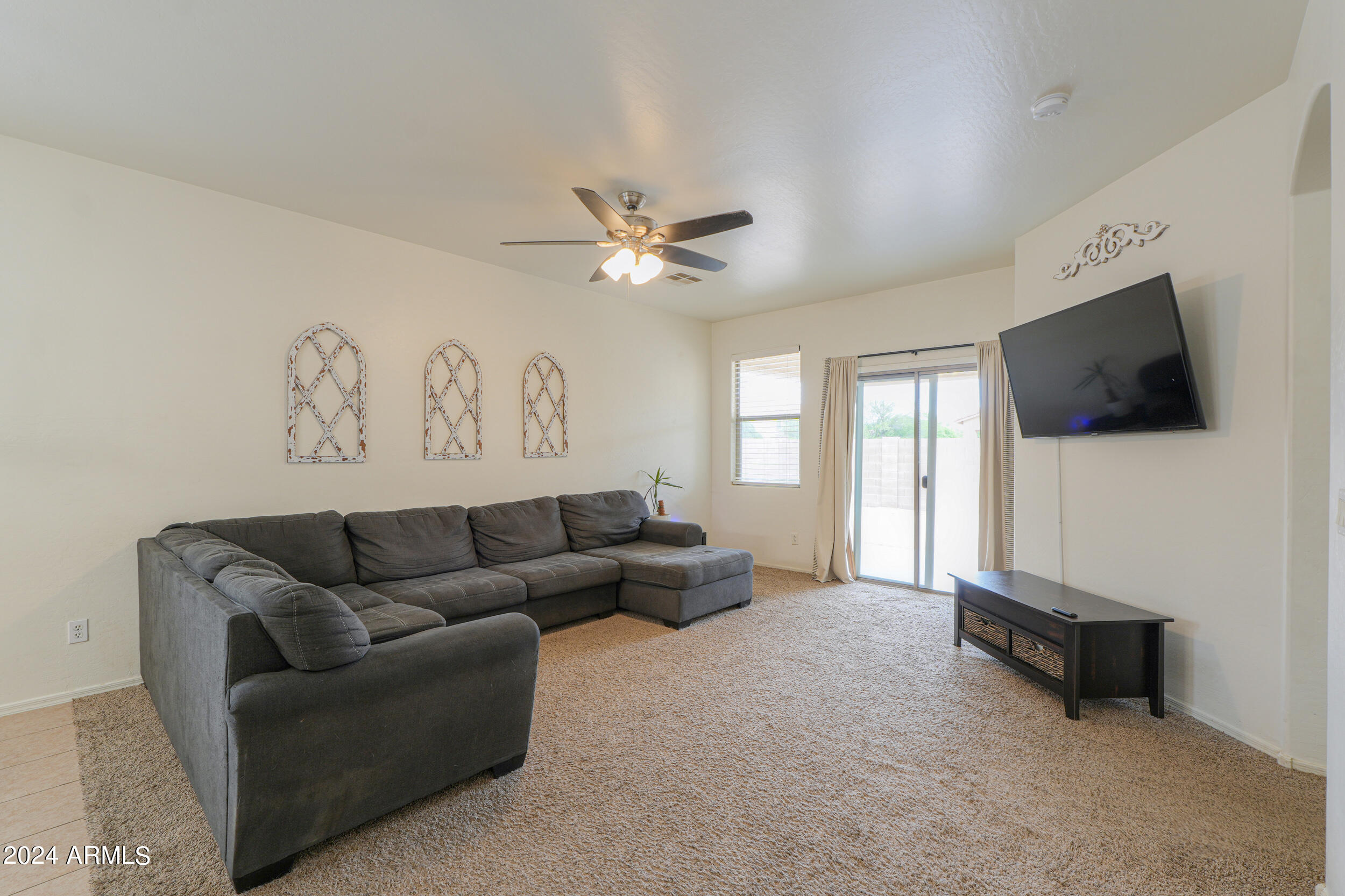 44236 Roth Road Maricopa, AZ 85138 - Photo 23 of 45 a living room with furniture and a flat screen tv
