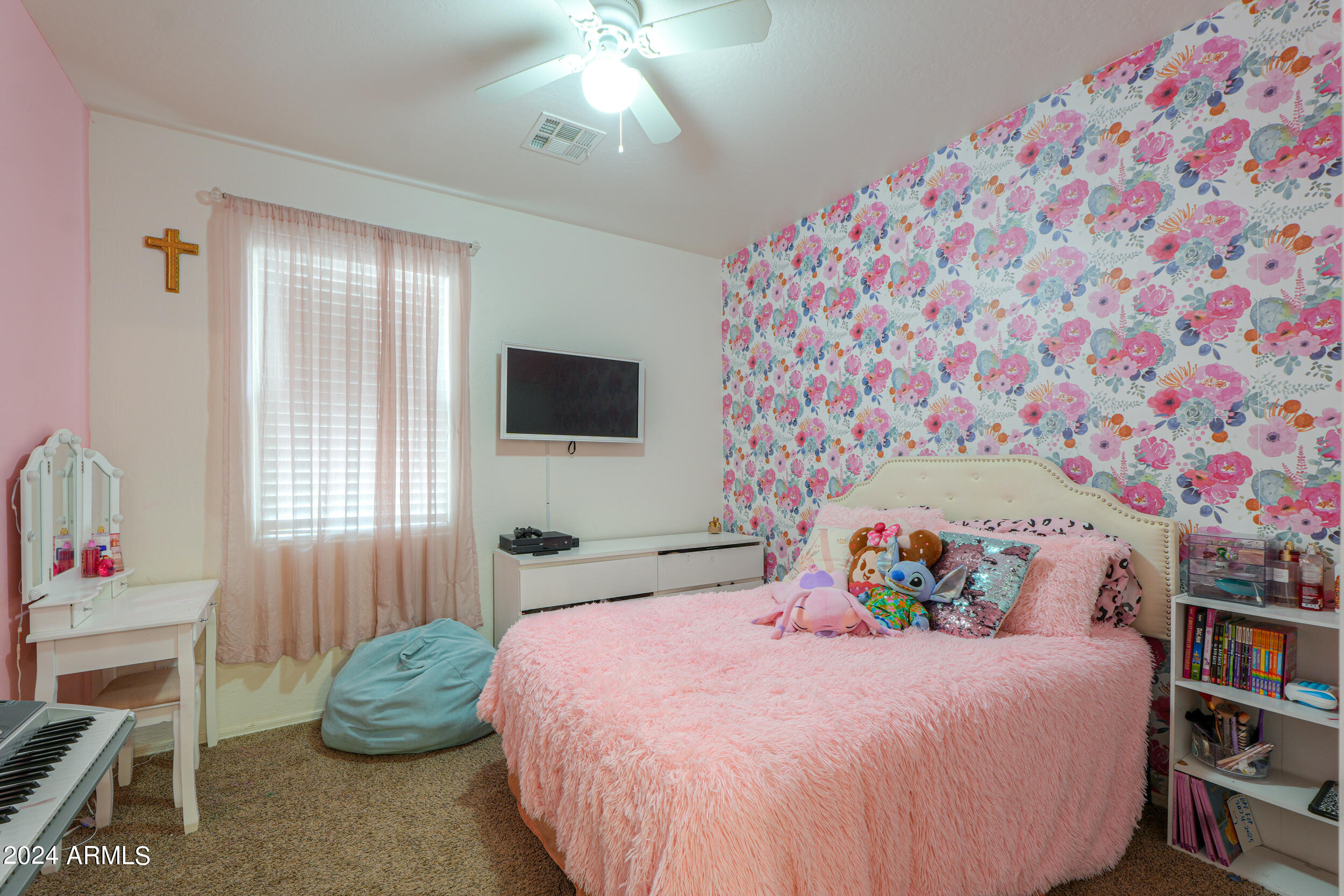 44236 Roth Road Maricopa, AZ 85138 - Photo 27 of 45 a bedroom with a bed and flat screen tv