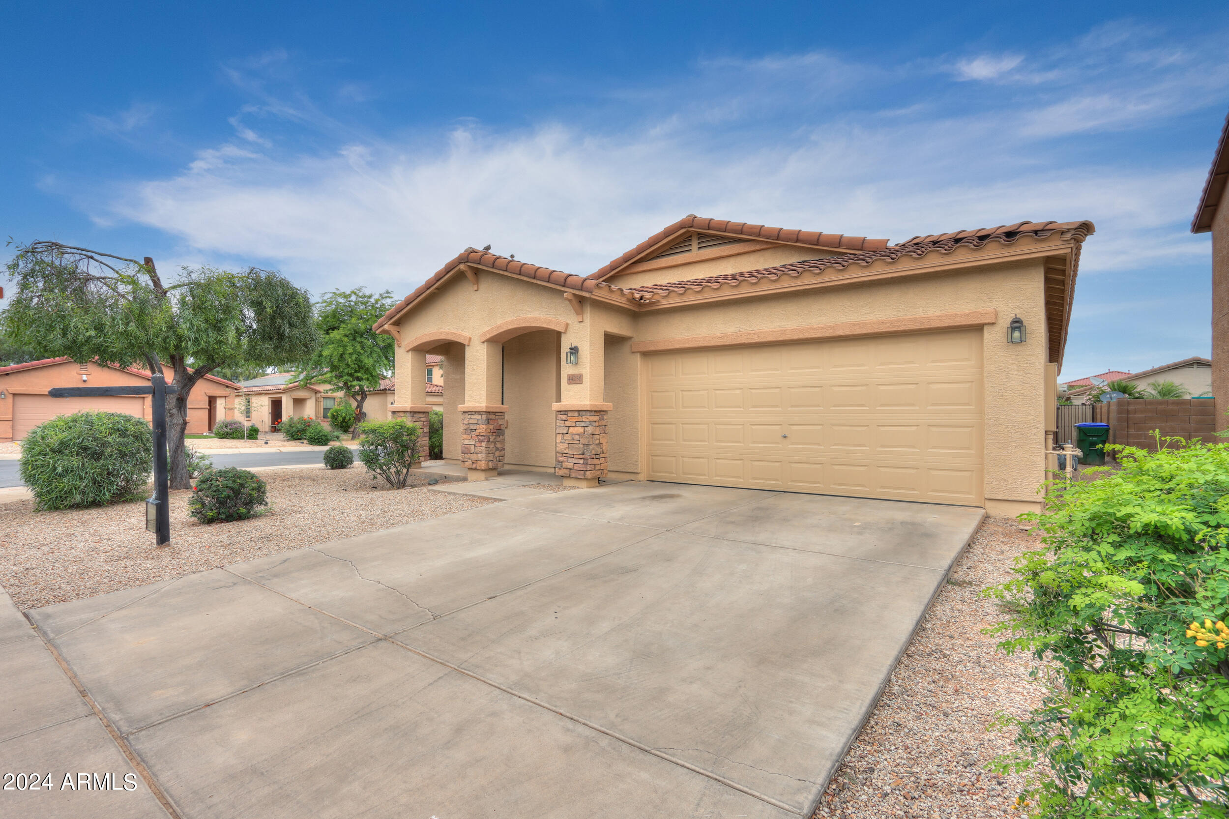 44236 Roth Road Maricopa, AZ 85138 - Photo 3 of 45 a front view of a house with a yard and garage