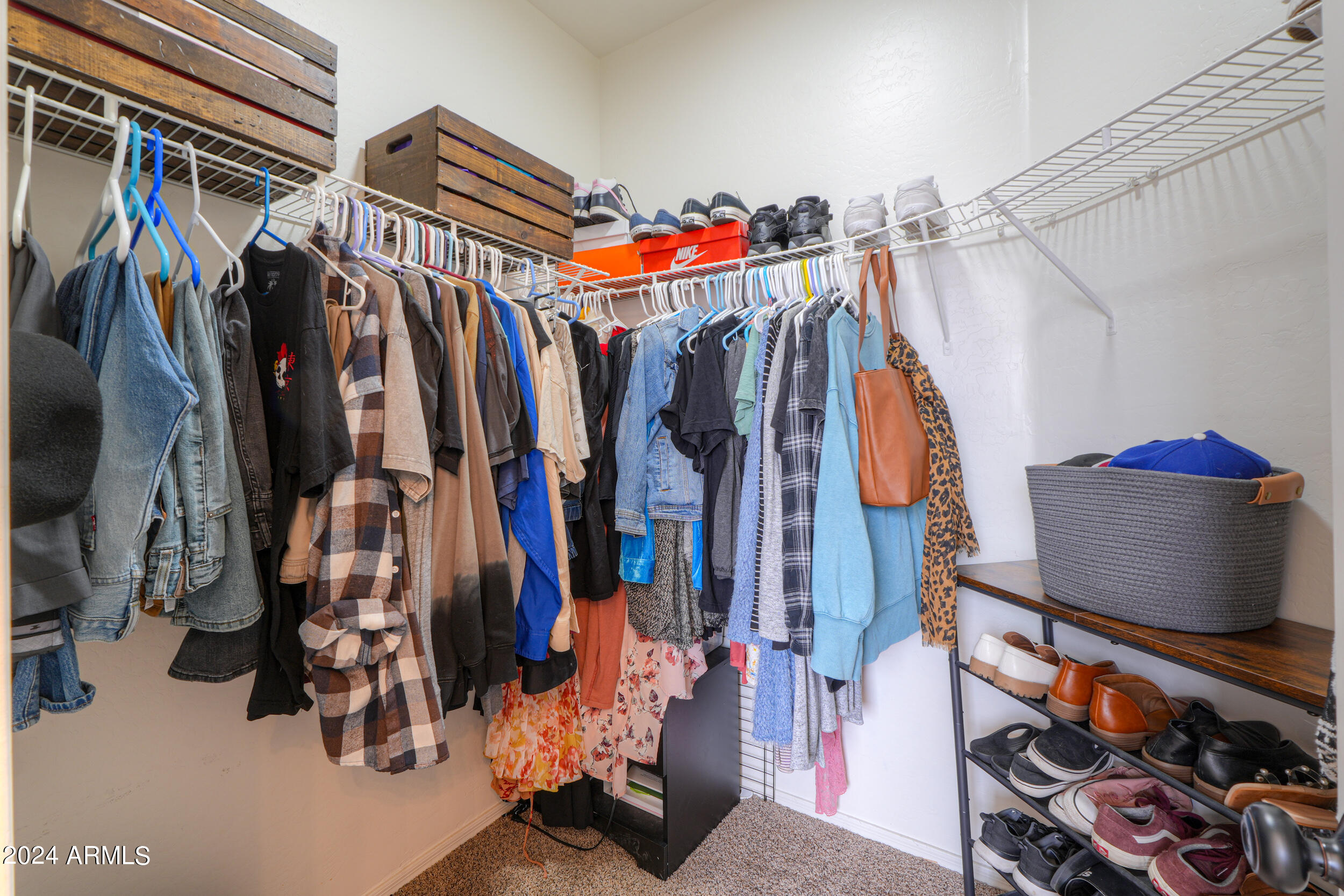 44236 Roth Road Maricopa, AZ 85138 - Photo 34 of 45 a view of walk in closet with clothes and shoes