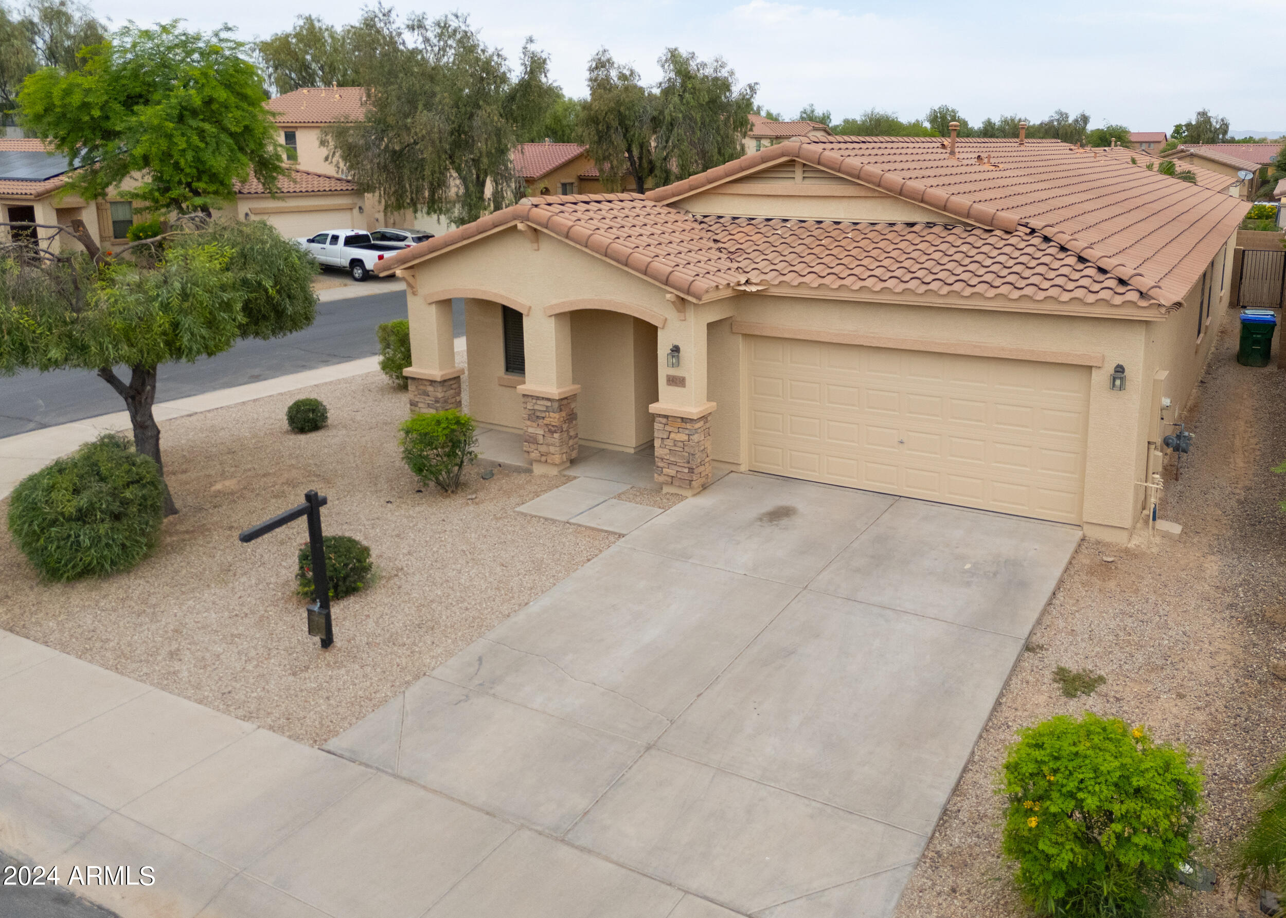44236 Roth Road Maricopa, AZ 85138 - Photo 37 of 45 a front view of a house with garden