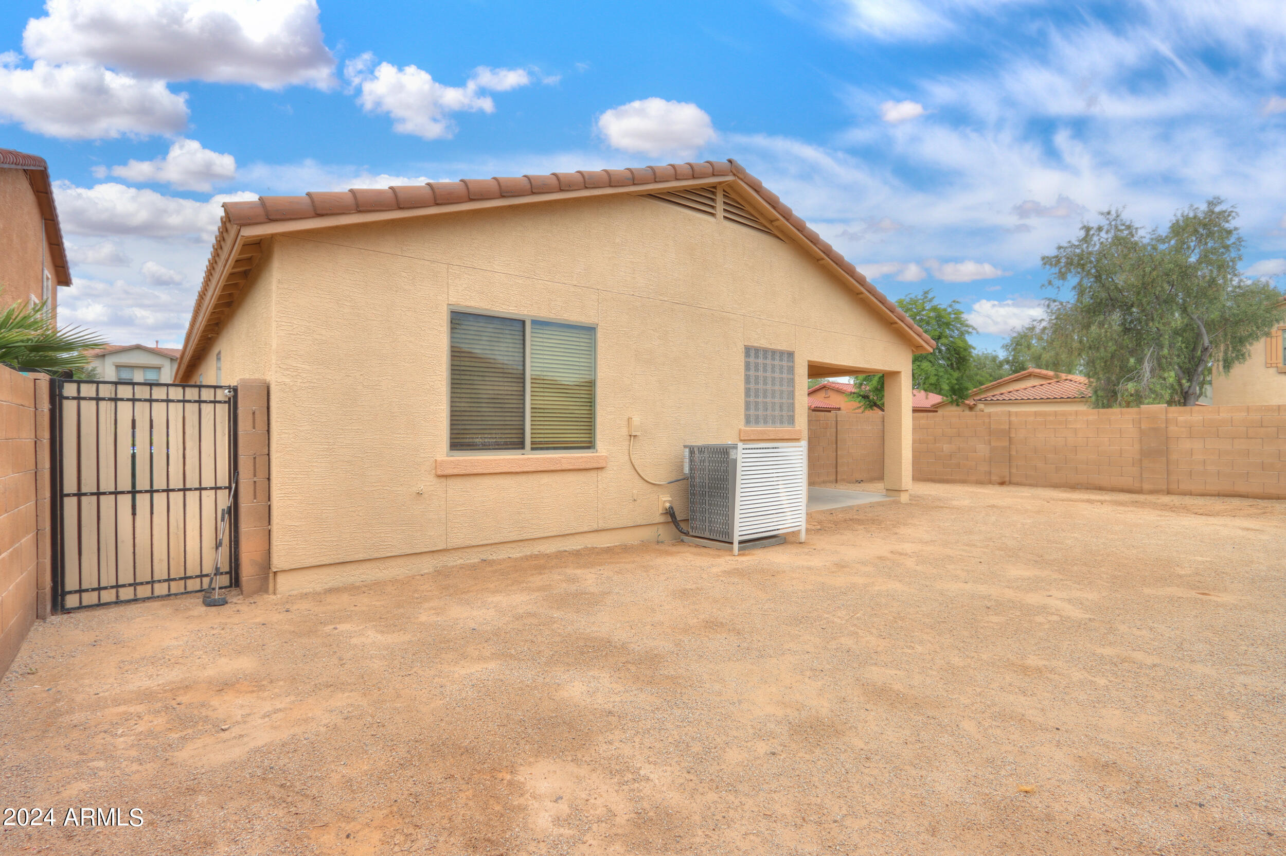 44236 Roth Road Maricopa, AZ 85138 - Photo 44 of 45 a view of a house with backyard and a tree