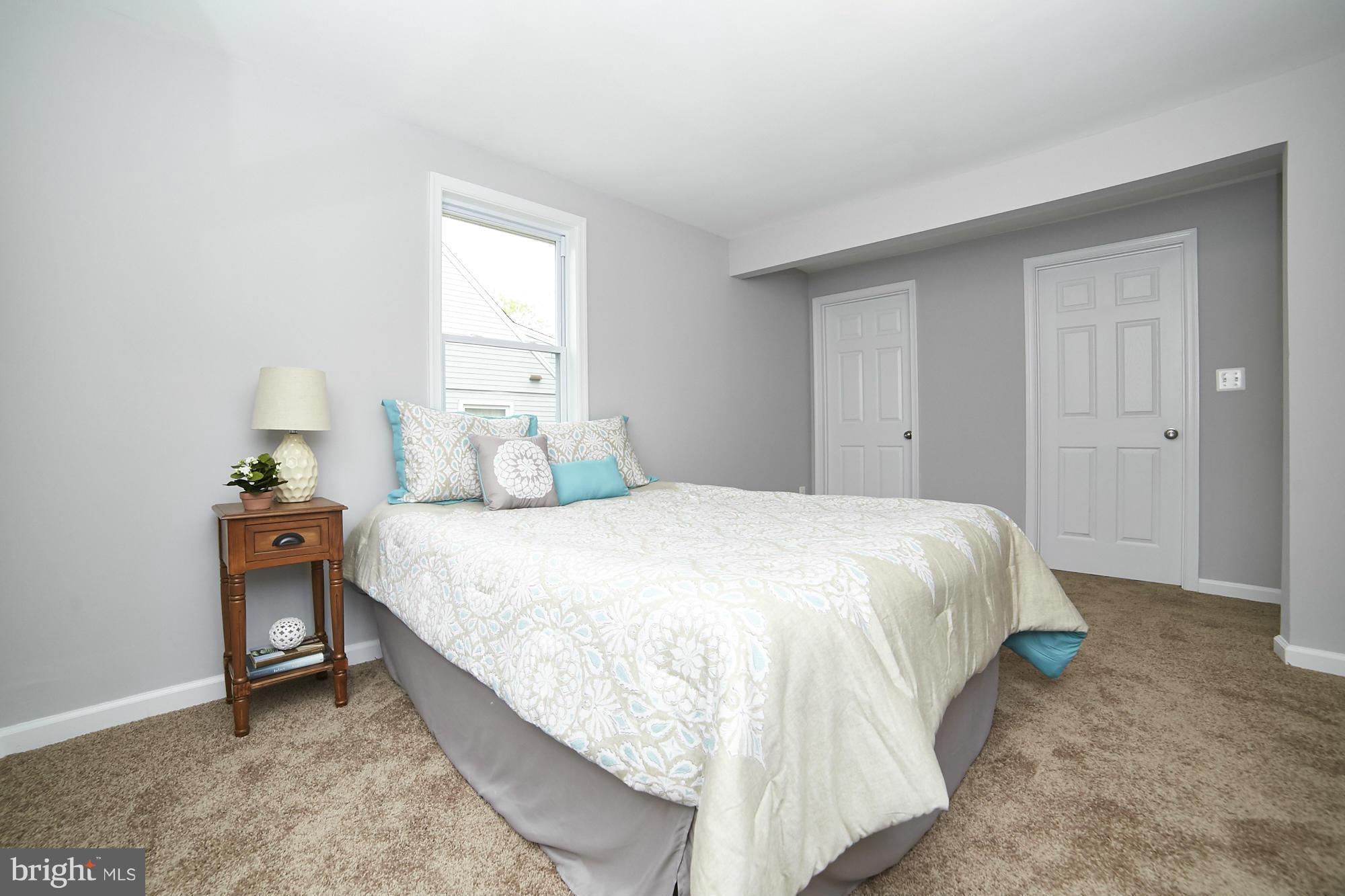 719 Cliffedge Road Baltimore, MD 21208 - Photo 17 of 30 a bedroom with a bed and window