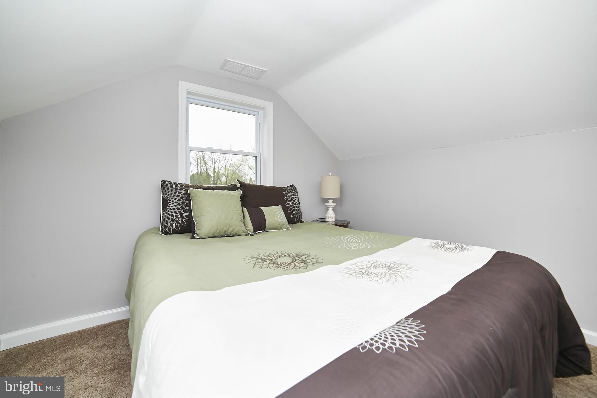 719 Cliffedge Road Baltimore, MD 21208 - Photo 23 of 30 a bedroom with a bed and window