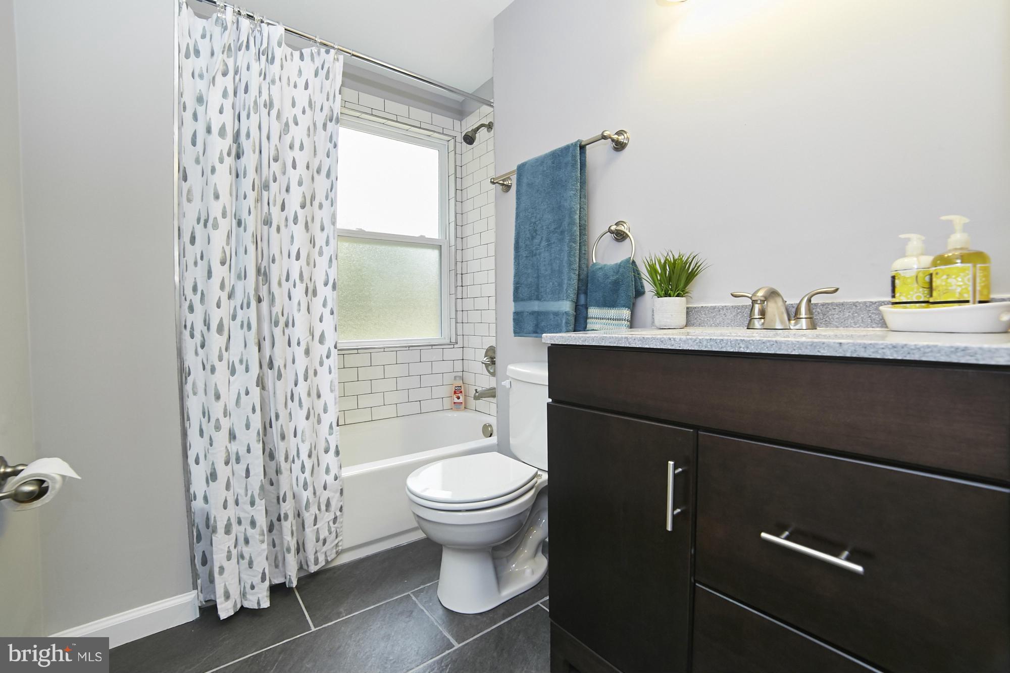 719 Cliffedge Road Baltimore, MD 21208 - Photo 24 of 30 a bathroom with a sink toilet and shower