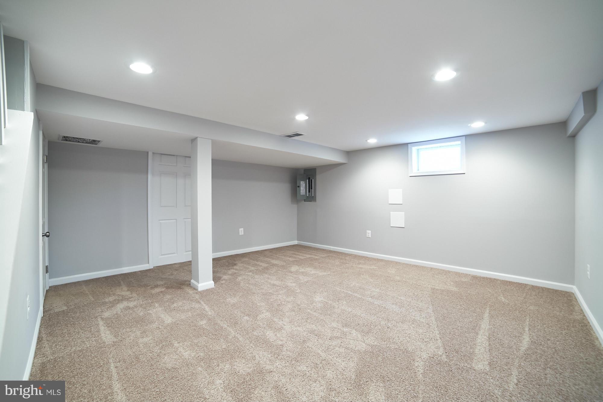 719 Cliffedge Road Baltimore, MD 21208 - Photo 27 of 30 an empty room with a natural light