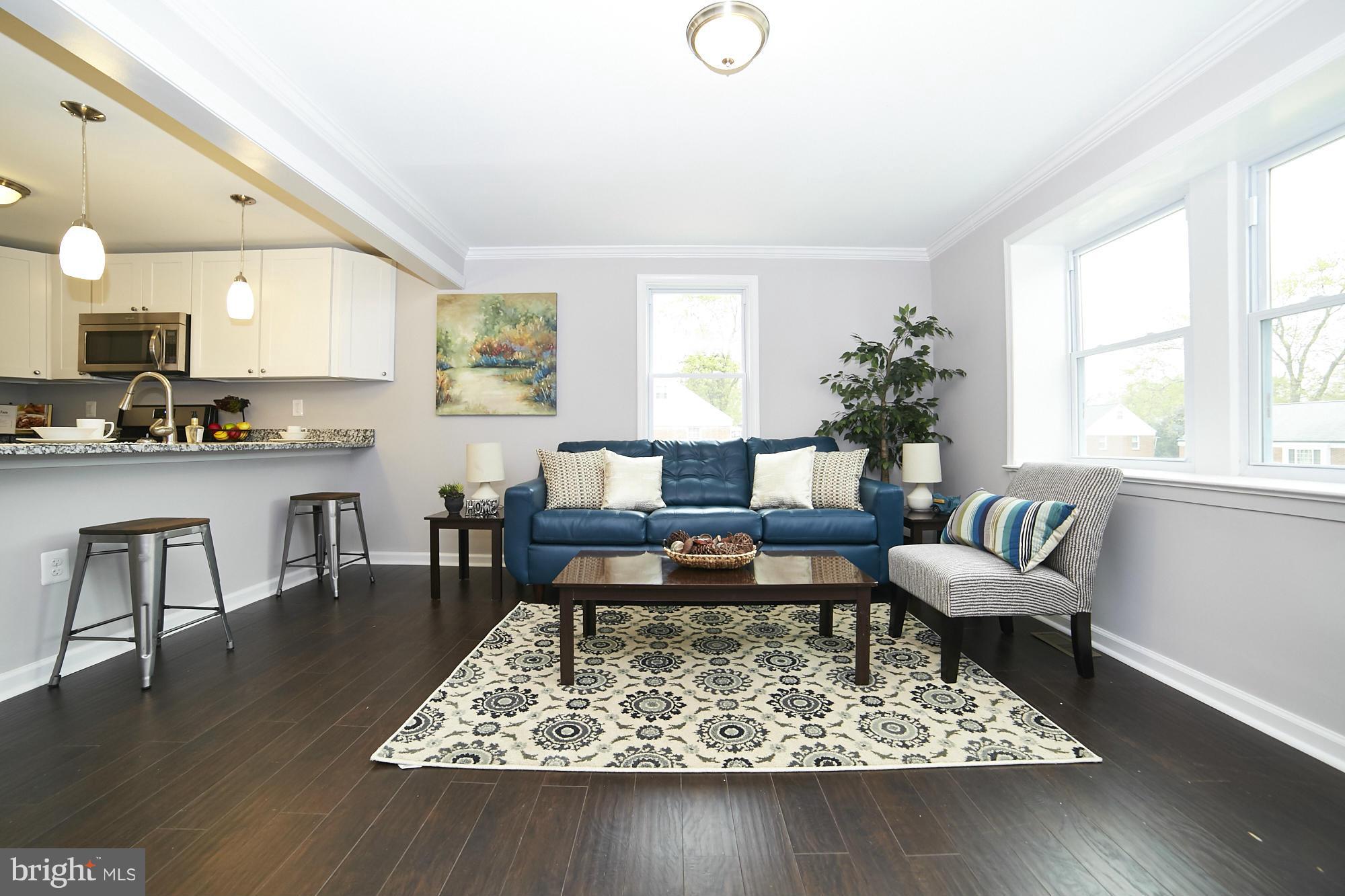 719 Cliffedge Road Baltimore, MD 21208 - Photo 5 of 30 a living room with furniture and a rug