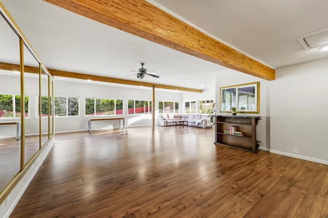 a utility room with multiple dryer and washer