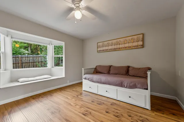 a view of a house with swimming pool and sitting area