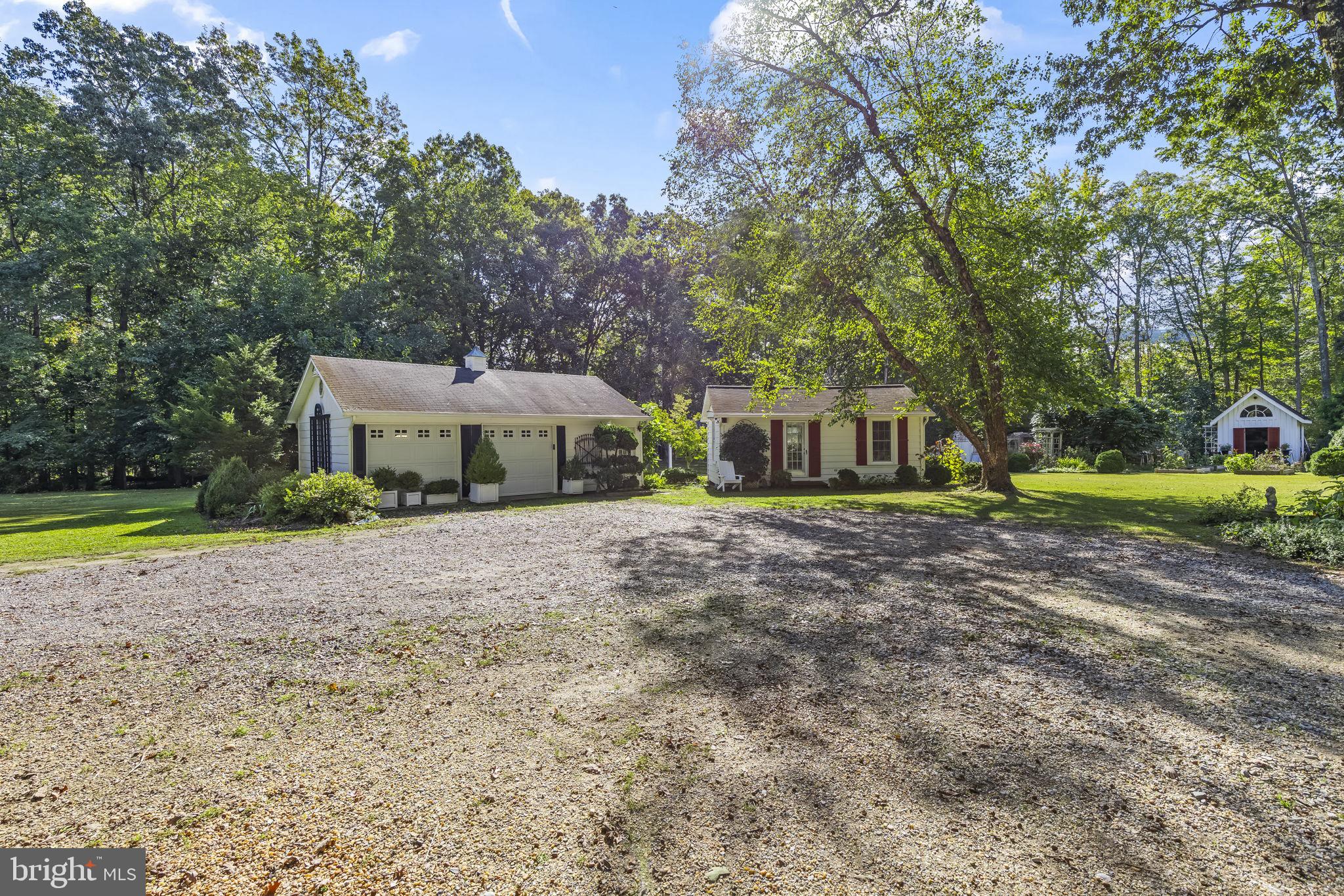 8150 Fairground Road La Plata, MD 20646 - Photo 13 of 100 a front view of a house with a yard and green space
