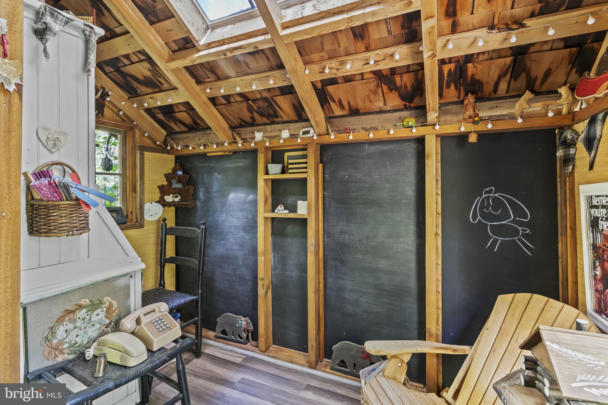 8150 Fairground Road La Plata, MD 20646 - Photo 21 of 100 a view of entryway with a chair and wooden floor