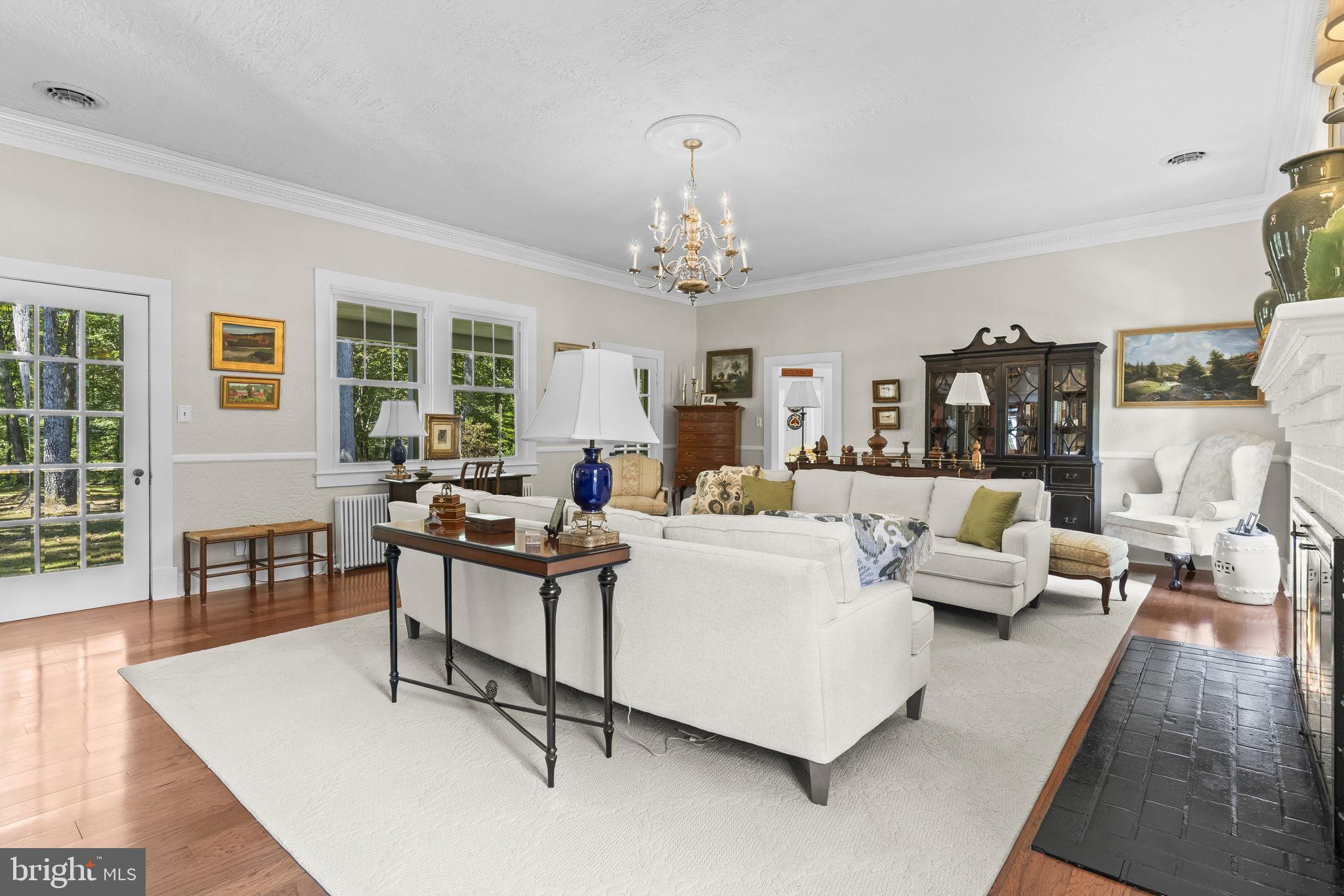 8150 Fairground Road La Plata, MD 20646 - Photo 30 of 100 a living room with furniture and a chandelier