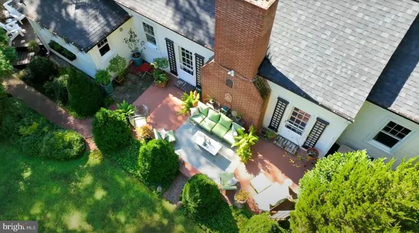 a front view of a house with potted plants