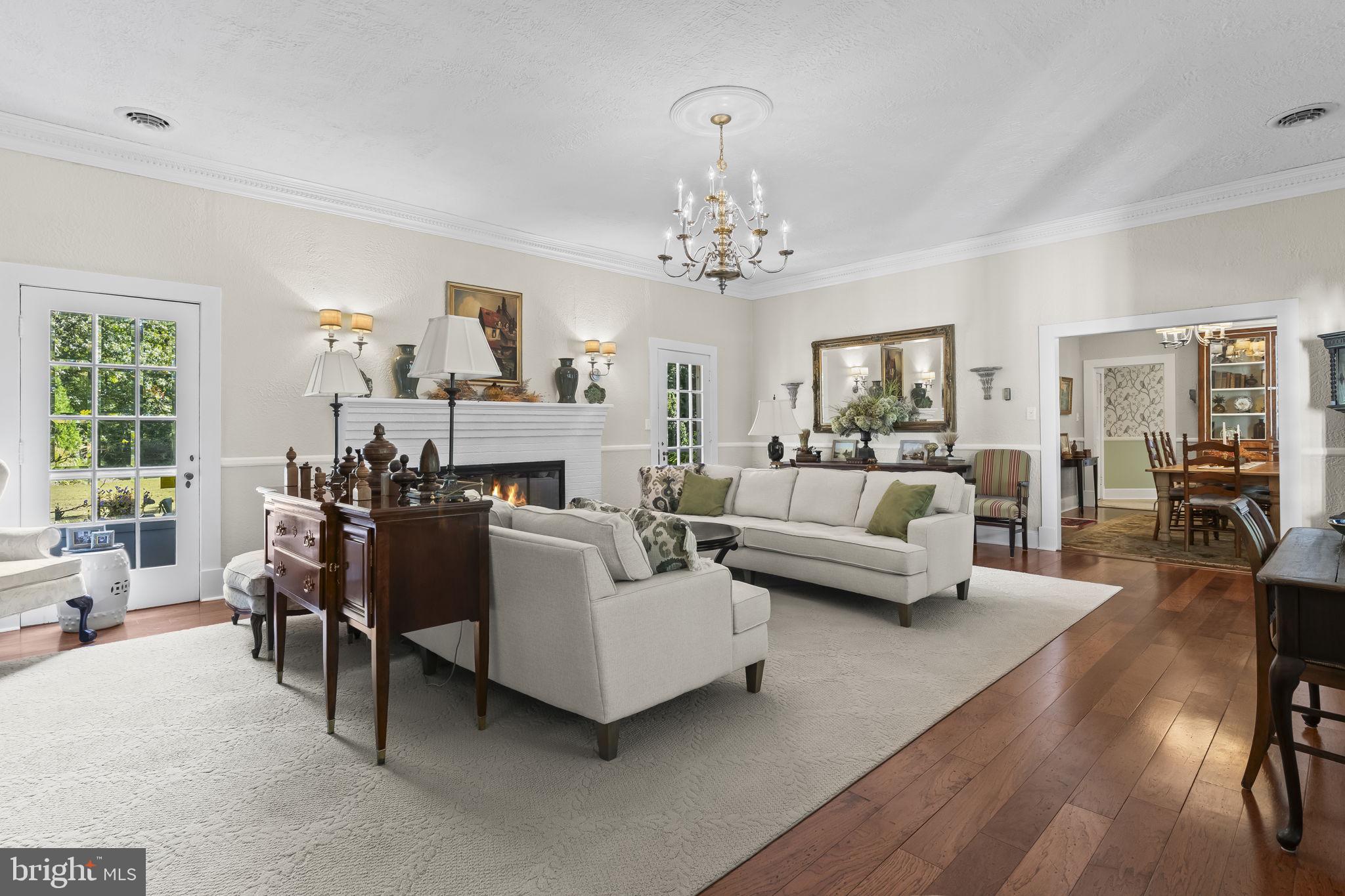 8150 Fairground Road La Plata, MD 20646 - Photo 32 of 100 a living room with furniture and a chandelier